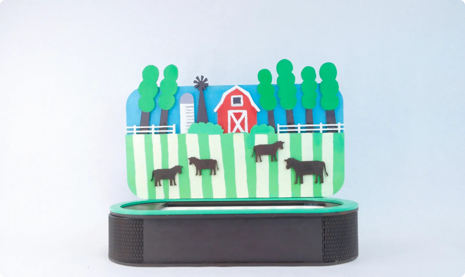 The real country board: a painted, layered farm behind the base